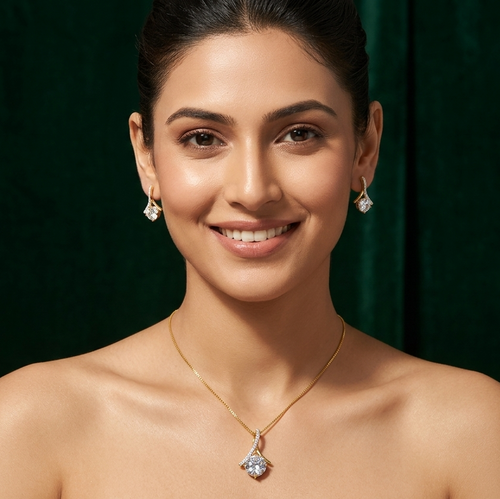 Woman wearing a necklace and earrings against a dark green background